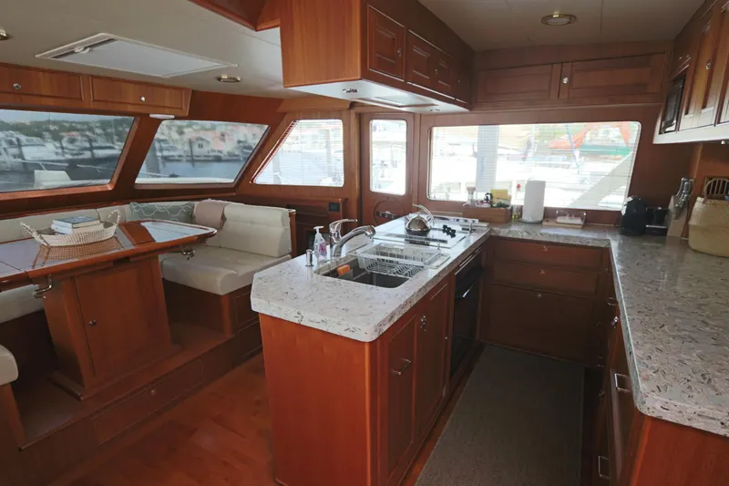 Mi Cielo Yacht Photos Pics Luxurious 2017 Marlow Explorer 49E yacht interior with modern kitchen and dining area.