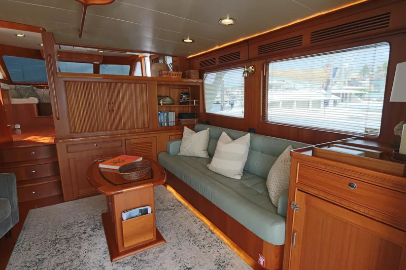 Mi Cielo Yacht Photos Pics Luxurious interior of 2017 Marlow Explorer 49E yacht with elegant wood finishes and cozy seating.