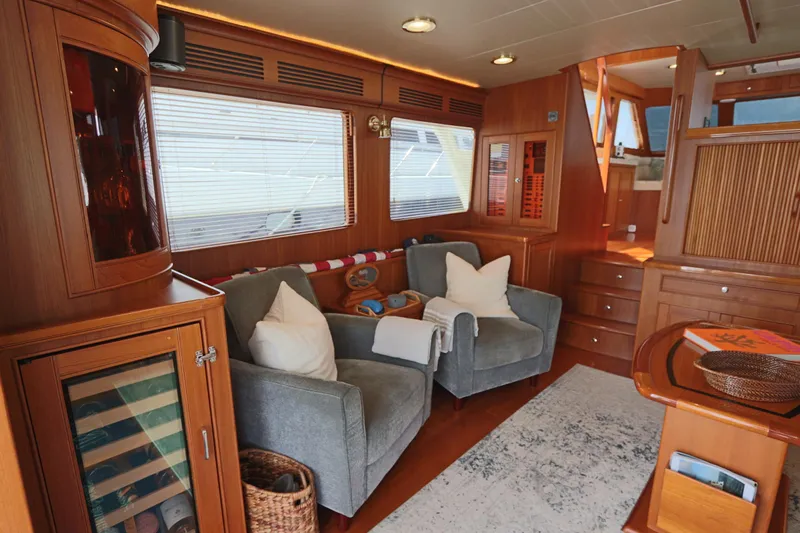 Mi Cielo Yacht Photos Pics Luxurious interior of 2017 Marlow Explorer 49E yacht with cozy seating and elegant wood finishes.