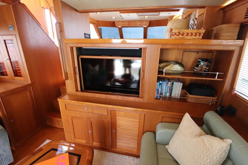 Mi Cielo Yacht Photos Pics Luxurious interior of 2017 Marlow Explorer 49E yacht with wooden cabinetry and modern amenities.