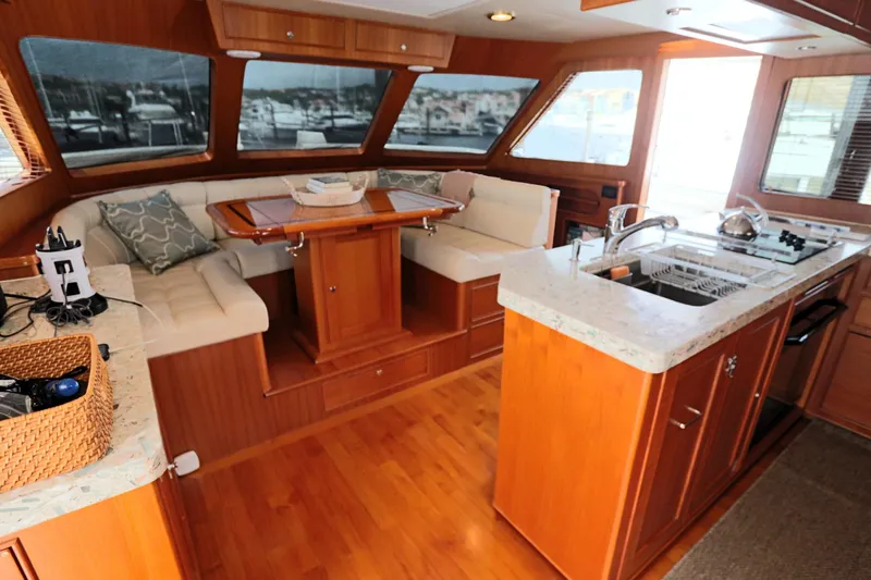 Mi Cielo Yacht Photos Pics Luxurious interior of 2017 Marlow Explorer 49E yacht with kitchen and seating area.