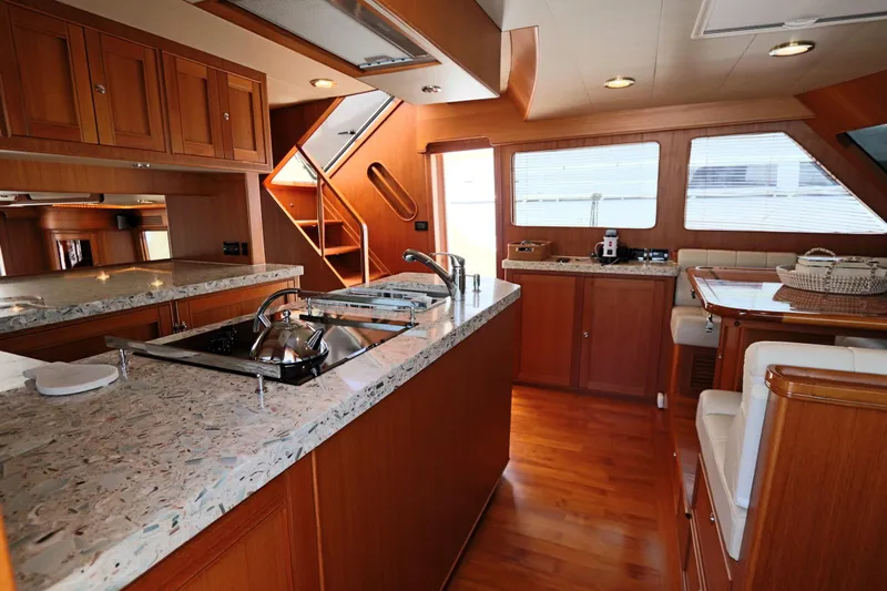 Mi Cielo Yacht Photos Pics Luxurious 2017 Marlow Explorer 49E yacht kitchen with modern amenities and elegant wood finishes.