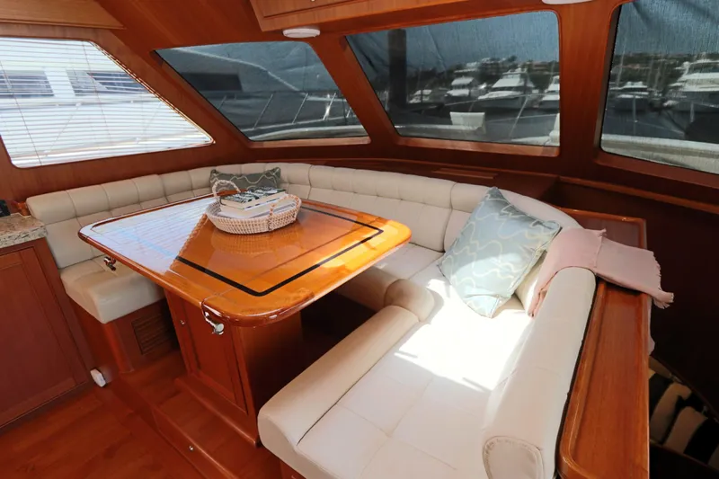Mi Cielo Yacht Photos Pics Luxurious interior of 2017 Marlow Explorer 49E yacht with elegant dining area.