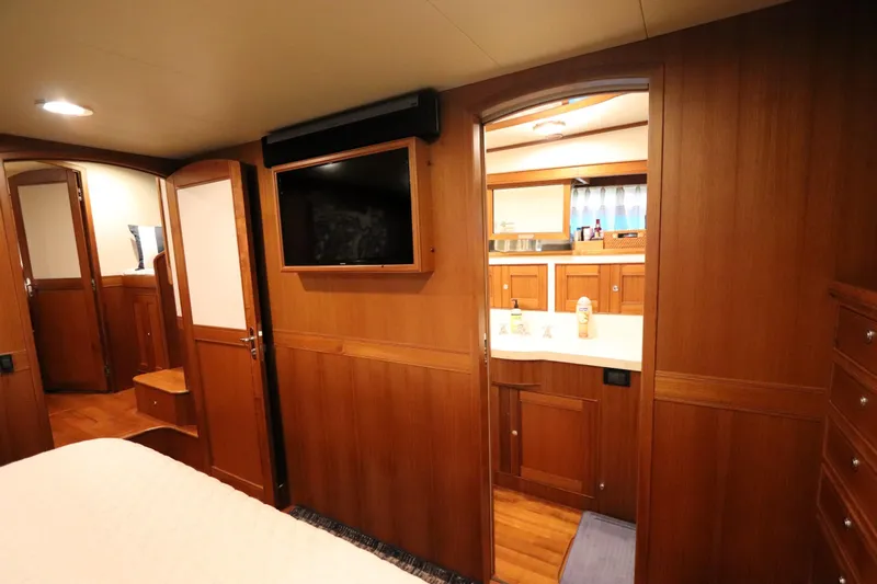 Mi Cielo Yacht Photos Pics Luxurious interior of 2017 Marlow Explorer 49E yacht with wood paneling and modern amenities.