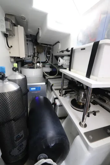 Mi Cielo Yacht Photos Pics Engine room of 2017 Marlow Explorer 49E yacht with equipment and storage tanks.