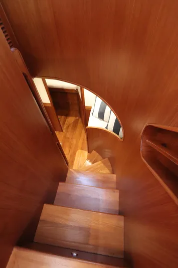 Mi Cielo Yacht Photos Pics Wooden staircase inside 2017 Marlow Explorer 49E yacht, featuring elegant design and craftsmanship.