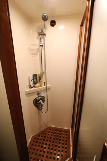 Mi Cielo Yacht Photos Pics Shower area in 2017 Marlow Explorer 49E yacht with wooden floor and modern fixtures.