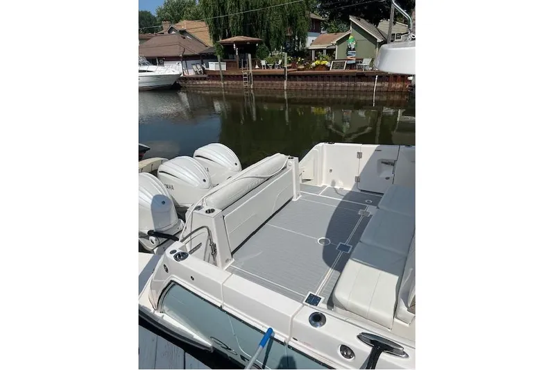  Yacht Photos Pics 2023 Regal 38 SAV boat with spacious deck and triple Yamaha engines.