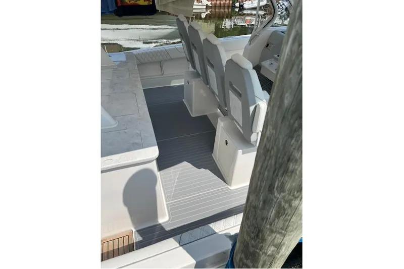  Yacht Photos Pics 2023 Regal 38 SAV boat interior with seating and deck view.
