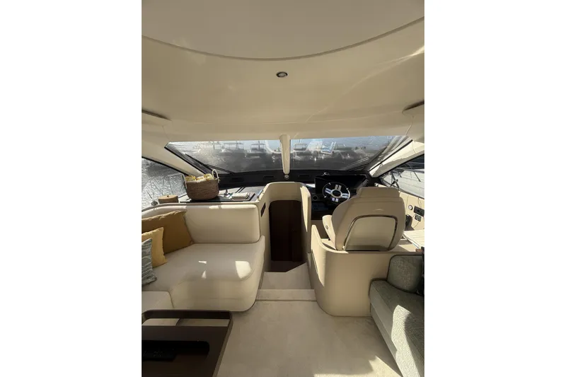  Yacht Photos Pics Luxurious interior of 2024 Azimut 53 Fly yacht with modern seating and helm.