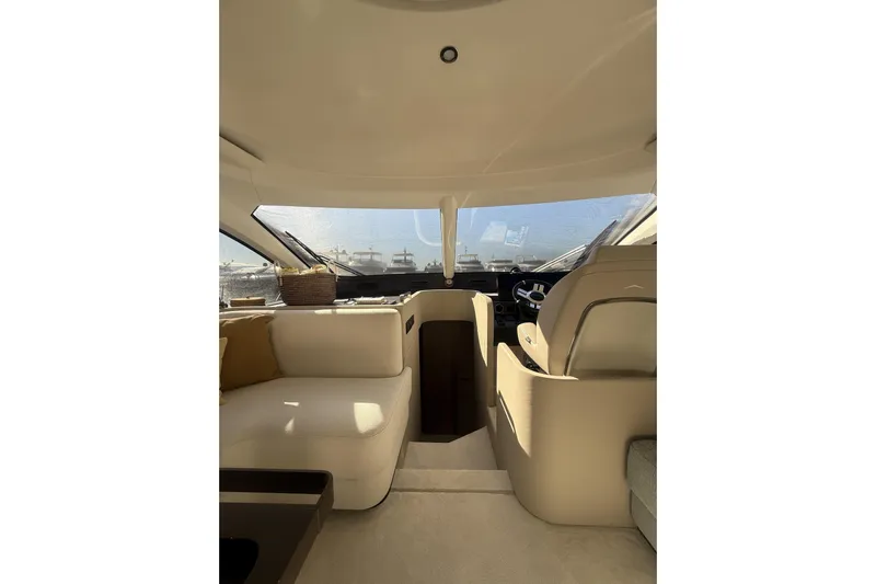  Yacht Photos Pics Luxurious interior of 2024 Azimut 53 Fly yacht with elegant seating and panoramic windows.