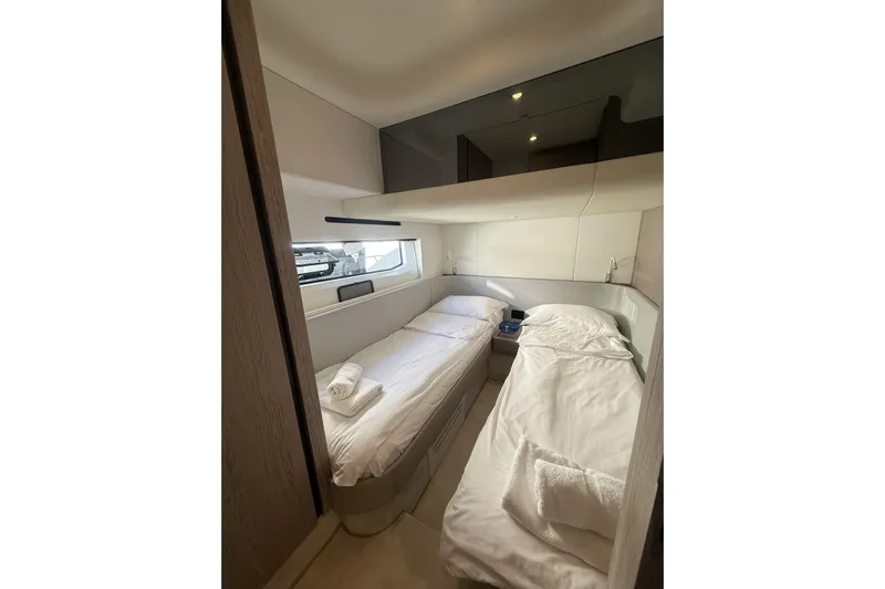  Yacht Photos Pics 2024 Azimut 53 Fly yacht cabin with twin beds and modern interior design.