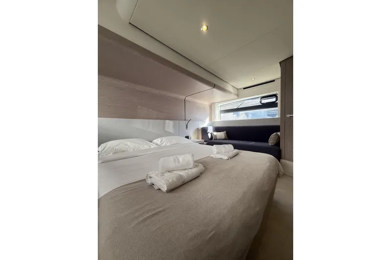  Yacht Photos Pics Luxurious bedroom interior of 2024 Azimut 53 Fly yacht with elegant bedding.