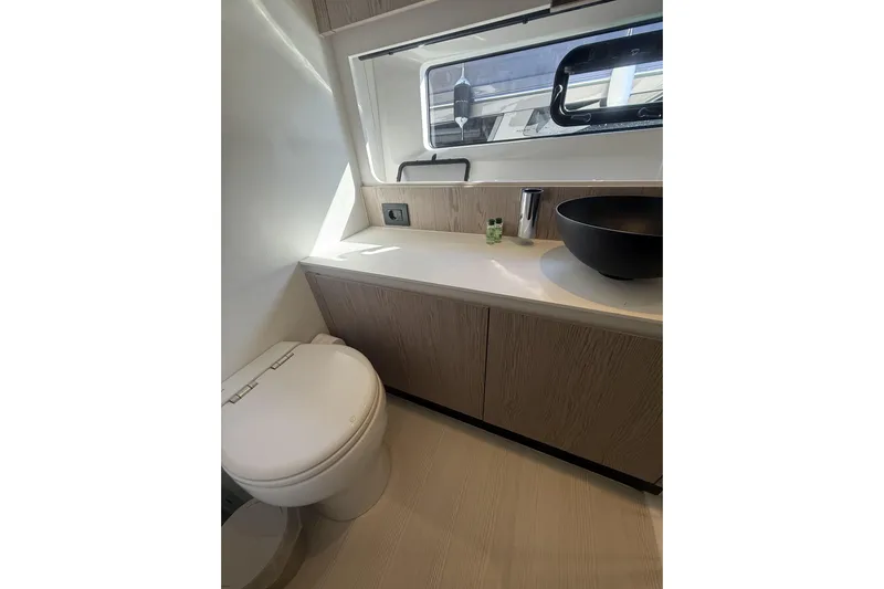  Yacht Photos Pics Luxurious bathroom interior of 2024 Azimut 53 Fly yacht with modern fixtures.