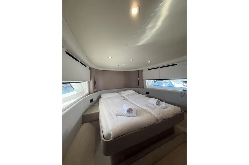  Yacht Photos Pics Luxurious bedroom interior of 2024 Azimut 53 Fly yacht with modern design.