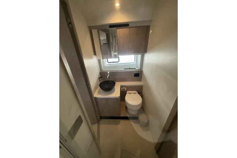  Yacht Photos Pics 2024 Azimut 53 Fly yacht bathroom with modern fixtures and sleek design.