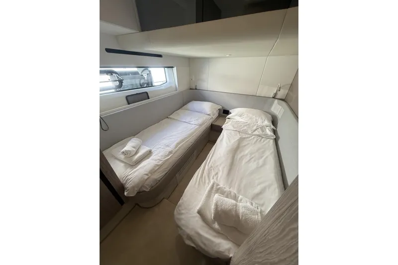  Yacht Photos Pics 2024 Azimut 53 Fly cabin with twin beds and modern interior design.