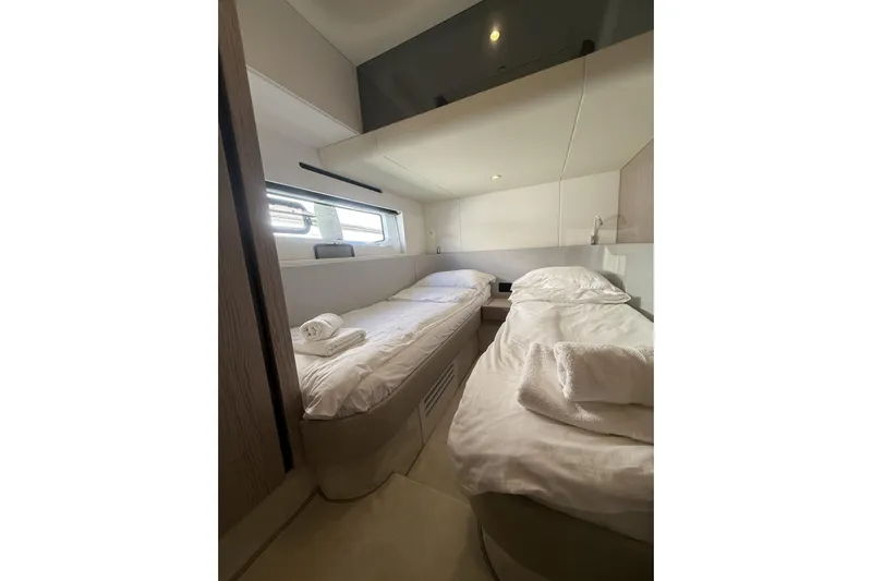  Yacht Photos Pics Luxurious twin cabin interior of 2024 Azimut 53 Fly yacht, featuring modern design and comfort.