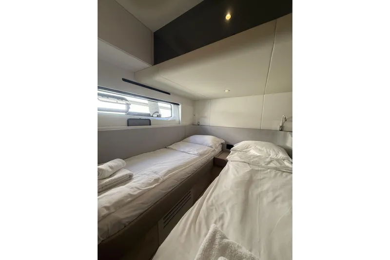  Yacht Photos Pics 2024 Azimut 53 Fly yacht cabin with twin beds and modern design.