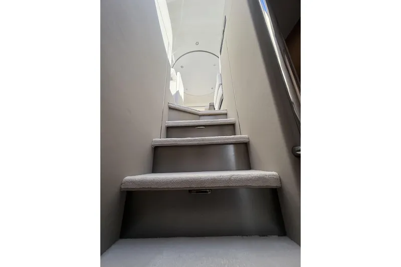  Yacht Photos Pics Staircase inside 2024 Azimut 53 Fly yacht, leading to upper deck.
