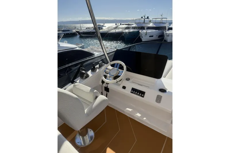  Yacht Photos Pics Helm of 2024 Azimut 53 Fly yacht with modern controls and ocean view.