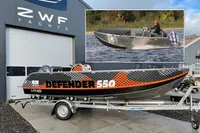 2022 Evens Defender 550 boat on trailer outside ZWF Yachts building.