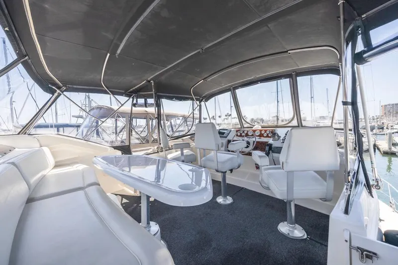 Just Joyce Yacht Photos Pics Interior view of 2000 Silverton 435 yacht with seating and helm station.