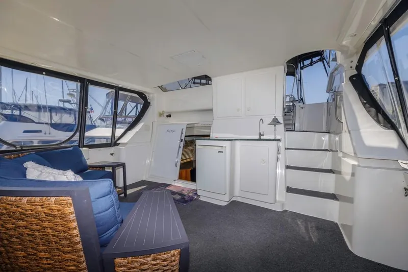 Just Joyce Yacht Photos Pics Interior of 2000 Silverton 435 yacht with seating, kitchenette, and stairs.