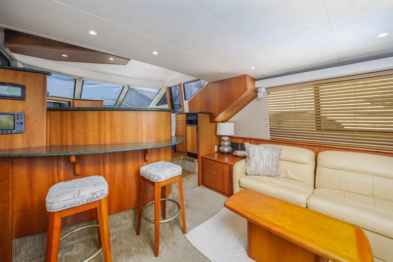 Just Joyce Yacht Photos Pics Interior of 2000 Silverton 435 yacht with modern seating and wooden accents.