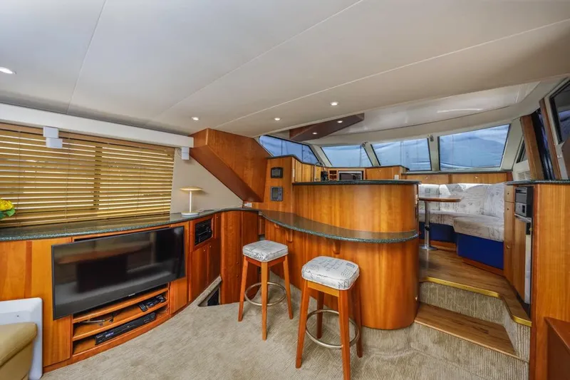 Just Joyce Yacht Photos Pics Luxurious interior of a 2000 Silverton 435 yacht with wood finishes and modern amenities.