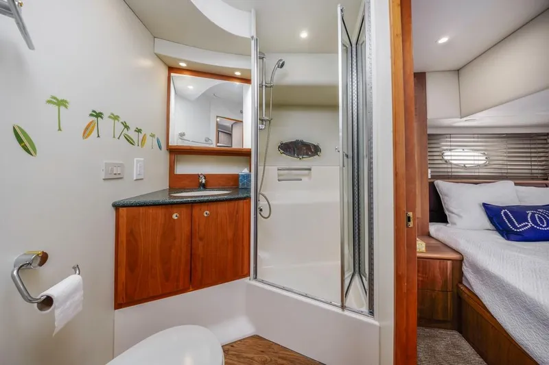 Just Joyce Yacht Photos Pics Luxurious bathroom and bedroom interior of a 2000 Silverton 435 yacht.