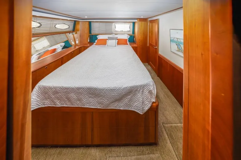 Just Joyce Yacht Photos Pics Luxurious cabin interior of 2000 Silverton 435 yacht with cozy bedding and wood finish.