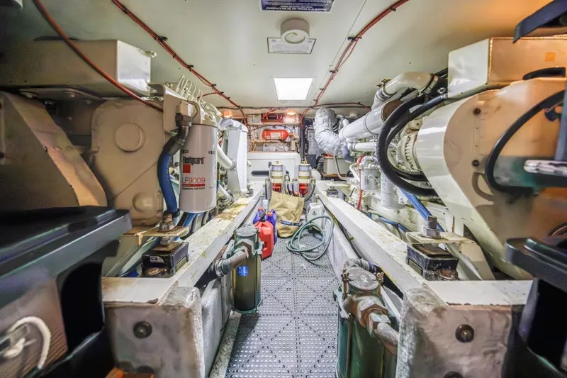 Just Joyce Yacht Photos Pics Engine room of a 2000 Silverton 435 yacht, showcasing mechanical components and equipment.