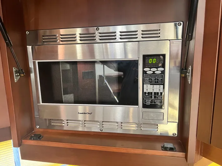 Day Off Yacht Photos Pics Built-in Franklin Chef microwave in 2015 Regal 53 Sport Coupe yacht kitchen.