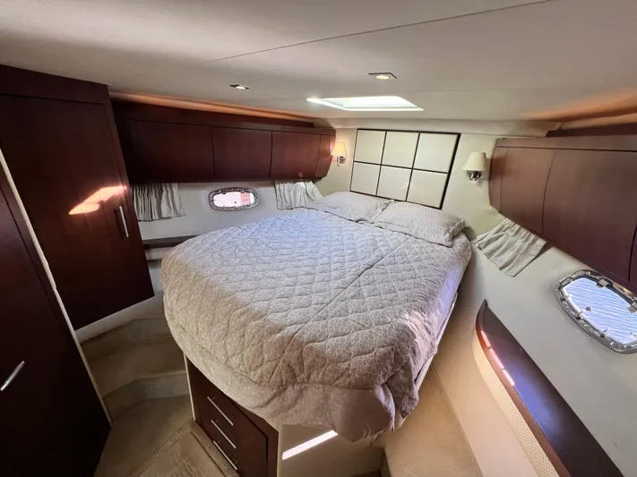 Day Off Yacht Photos Pics Luxurious bedroom interior of 2015 Regal 53 Sport Coupe yacht with elegant wood finishes.