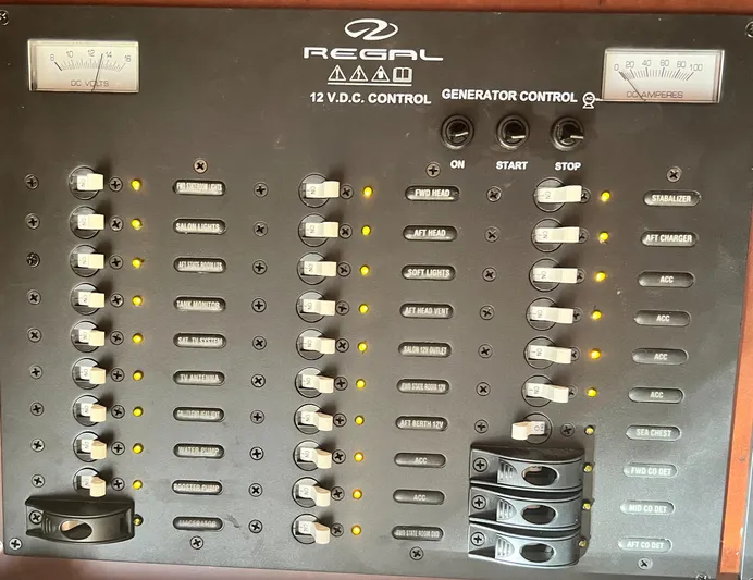 Day Off Yacht Photos Pics Control panel of a 2015 Regal 53 Sport Coupe, featuring switches and gauges.