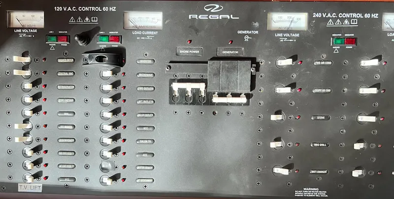 Day Off Yacht Photos Pics Control panel of a 2015 Regal 53 Sport Coupe, featuring voltage and current meters.
