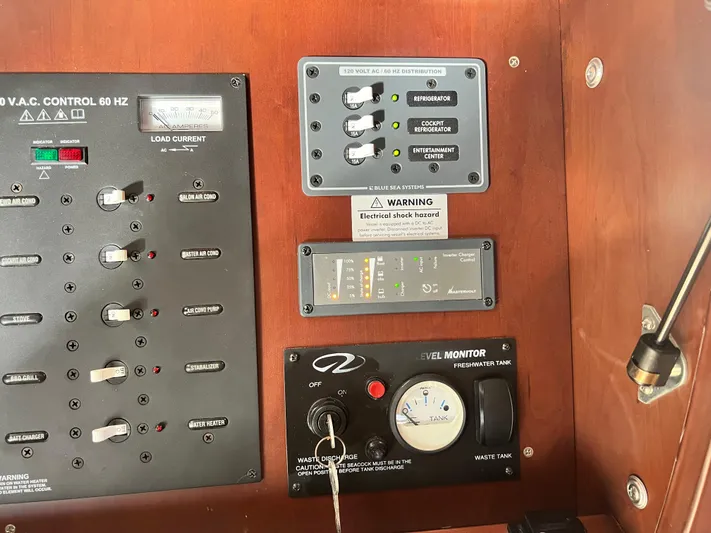 Day Off Yacht Photos Pics Control panel of a 2015 Regal 53 Sport Coupe with electrical and tank monitors.