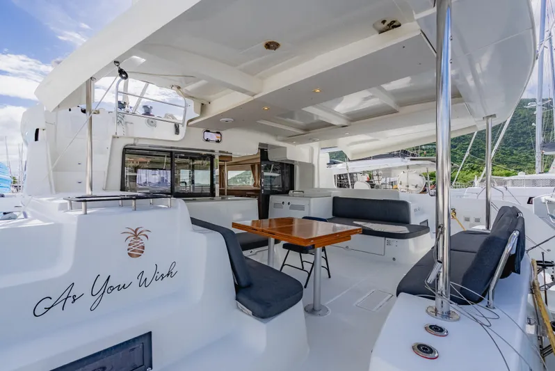As You Wish Yacht Photos Pics Spacious deck of 2020 Lagoon 46 catamaran with seating and dining area.