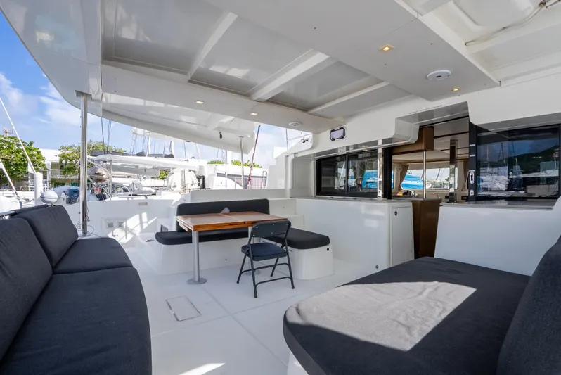 As You Wish Yacht Photos Pics Spacious deck of 2020 Lagoon 46 catamaran with seating and table.