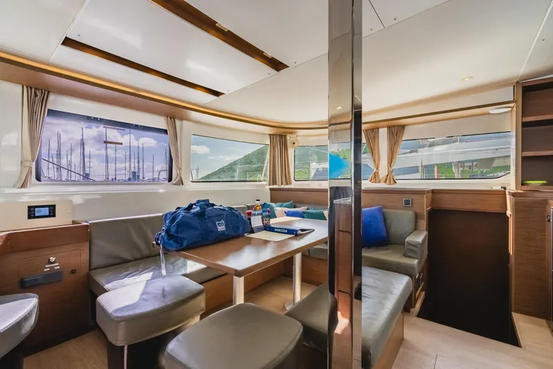 As You Wish Yacht Photos Pics Interior of 2020 Lagoon 46 catamaran, featuring spacious seating and large windows.
