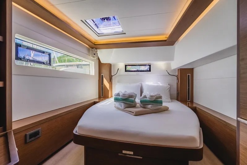 As You Wish Yacht Photos Pics Luxurious cabin interior of 2020 Lagoon 46 catamaran with modern design and ambient lighting.