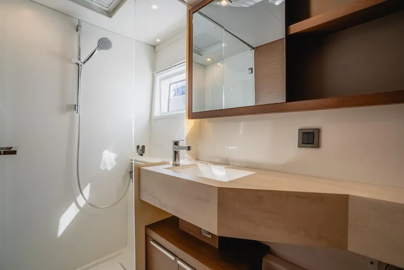As You Wish Yacht Photos Pics Modern bathroom in 2020 Lagoon 46 yacht with shower and sleek vanity.