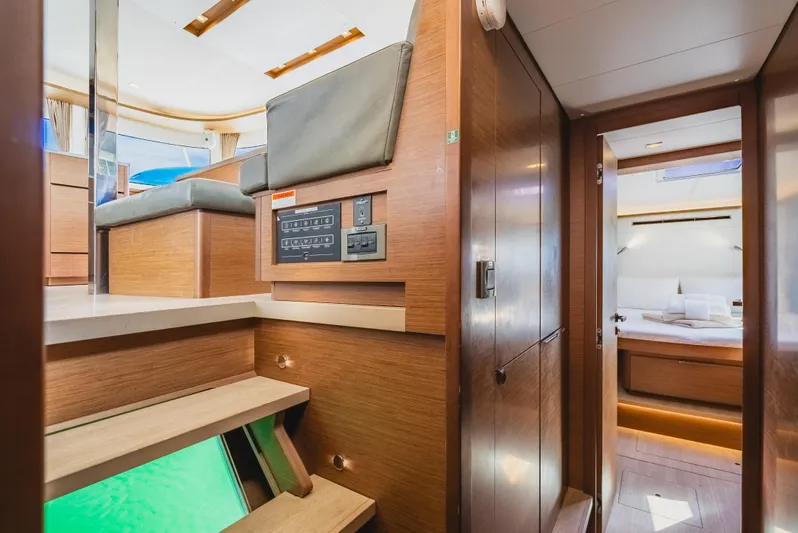 As You Wish Yacht Photos Pics Interior of 2020 Lagoon 46 yacht, featuring modern wood finishes and cozy cabin space.