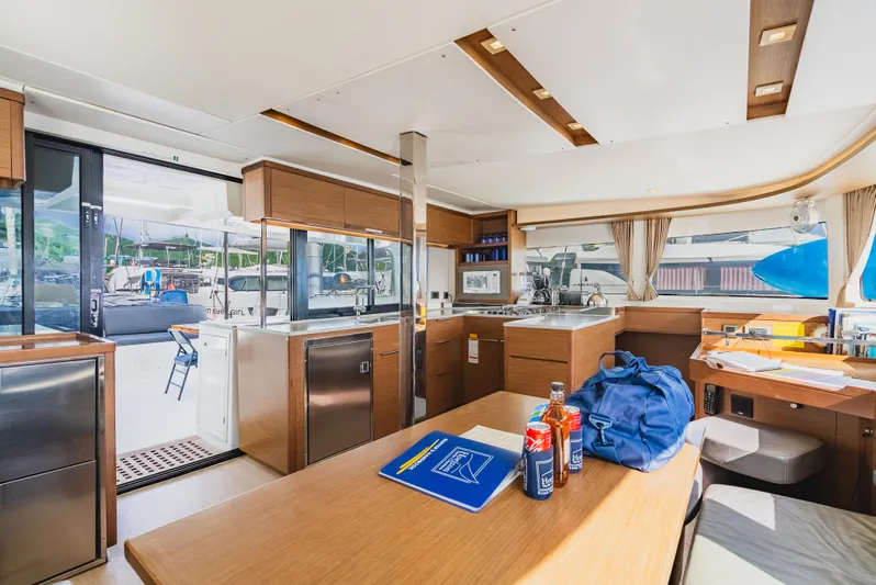 As You Wish Yacht Photos Pics Interior of 2020 Lagoon 46 yacht, featuring modern kitchen and dining area with natural light.