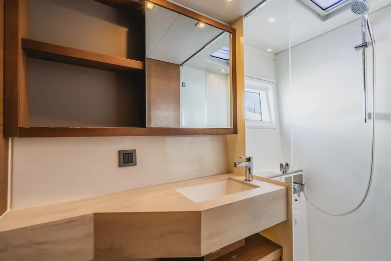 As You Wish Yacht Photos Pics Modern bathroom in 2020 Lagoon 46 yacht with sleek sink and shower.