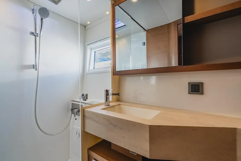 As You Wish Yacht Photos Pics Modern bathroom in 2020 Lagoon 46 yacht with sleek sink and shower.