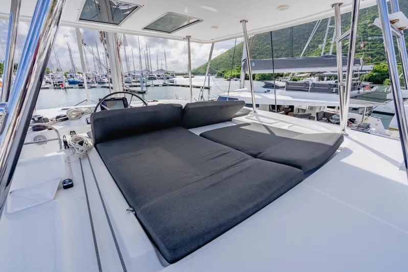 As You Wish Yacht Photos Pics 2020 Lagoon 46 yacht with spacious deck lounge area in marina setting.