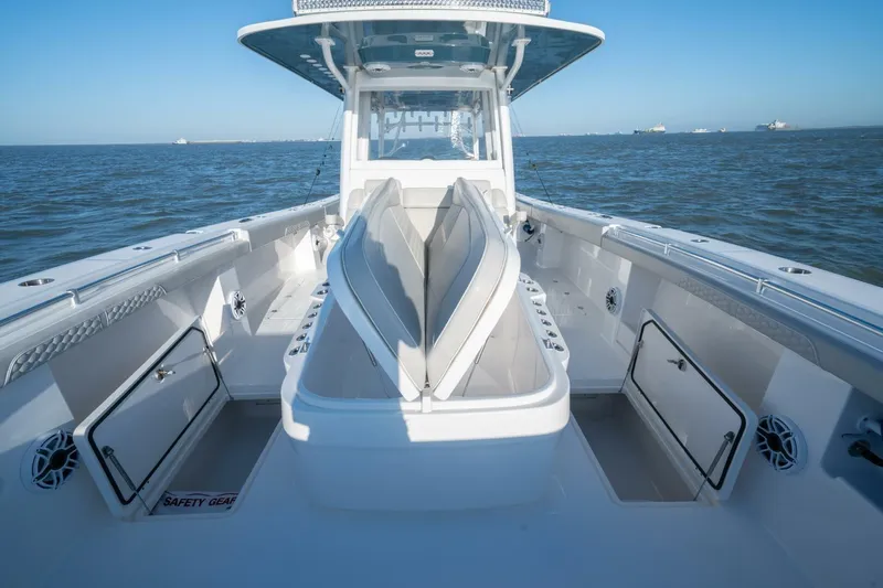 Catallac Yacht Photos Pics 2023 Invincible 46 Catamaran interior with open storage compartments on a calm sea.