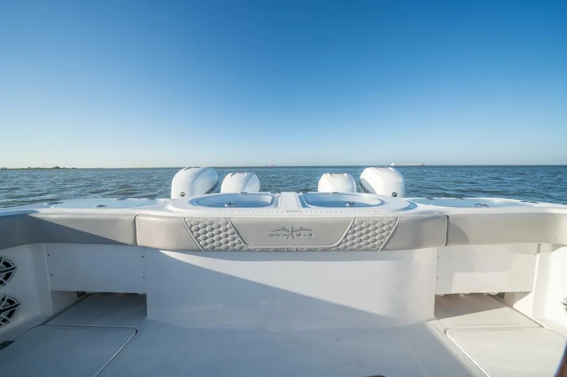 Catallac Yacht Photos Pics 2023 Invincible 46 Catamaran on open water, showcasing sleek design and powerful engines.